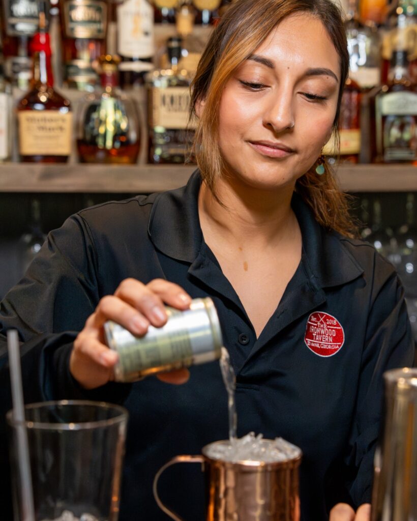 woman pouring a drink